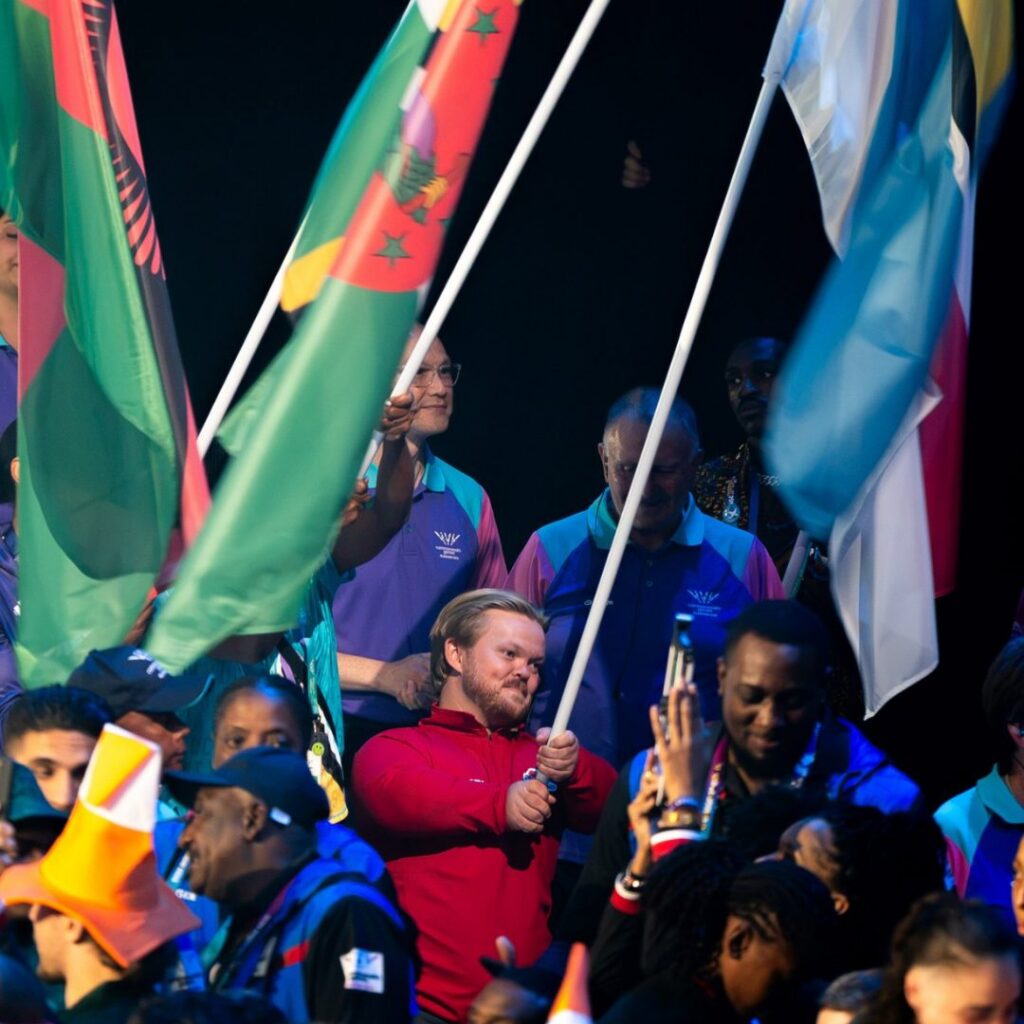 Mark Swan Team England flag bearer at Glasgow 2026 Closing Ceremony